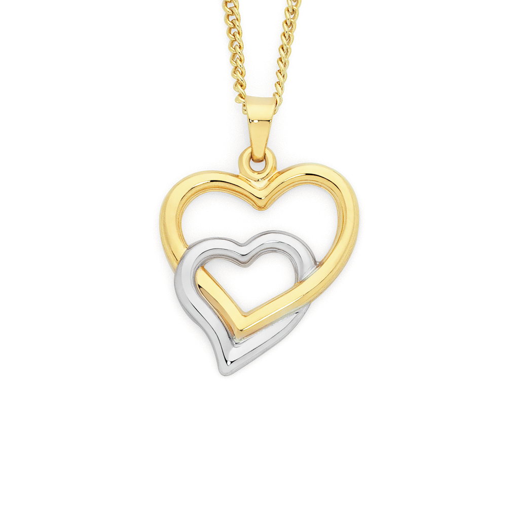 Sold at Auction: A 9ct gold pendant of heart form set with central …